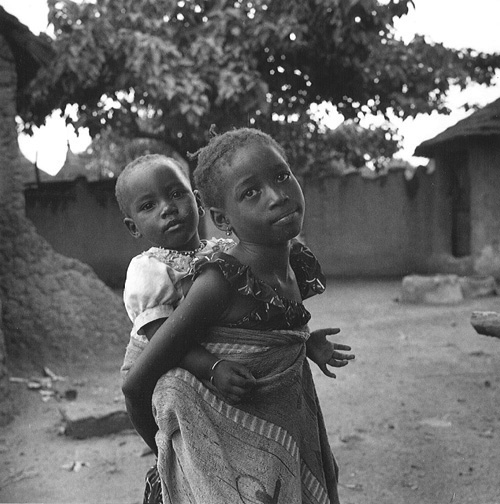 Girl carrying a younger girl